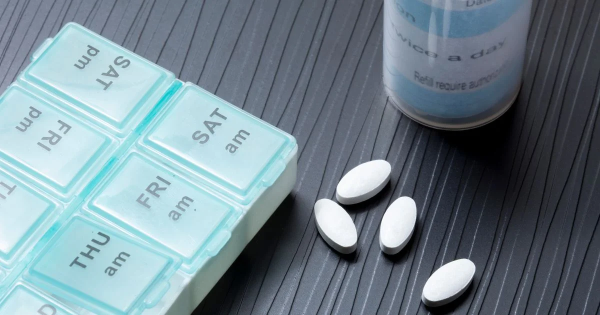 Weekly pill organizer with prescription tablets