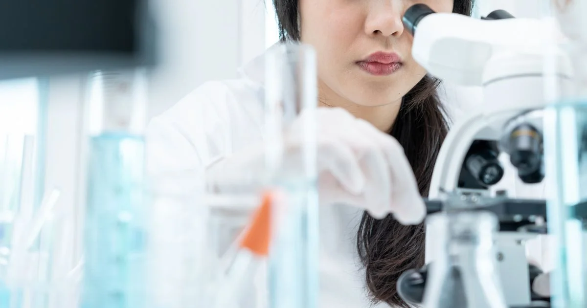 Researcher conducting pharmacogenetic testing in laboratory